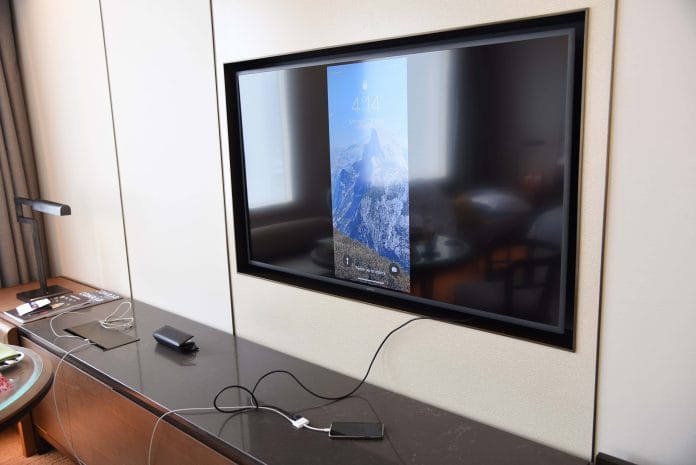 Adjustable TV with connectors accessible on the right
