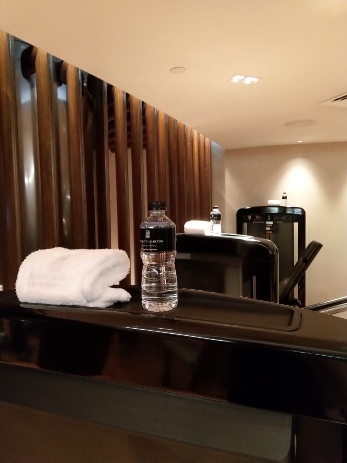 Thoughtfully placed water bottle and towel