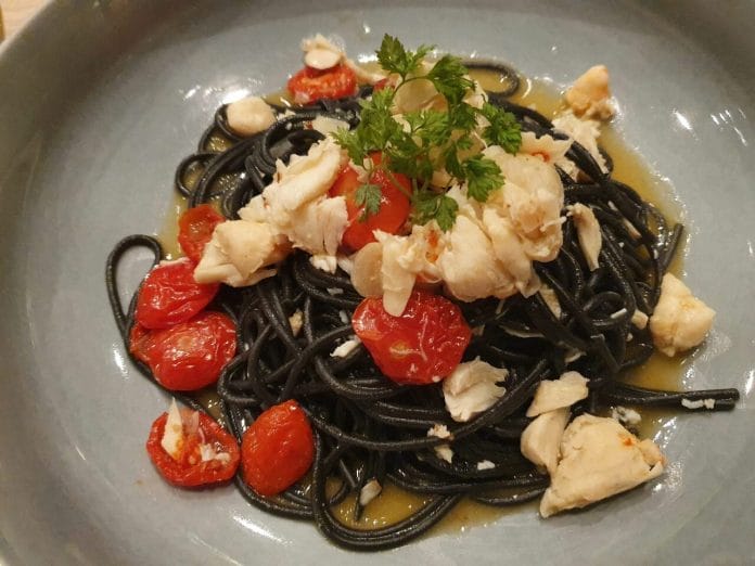 Squid ink tornarelli with crab