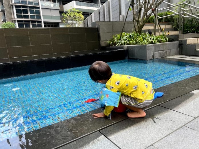 Toddler playing at Ascott Orchard baby pool
